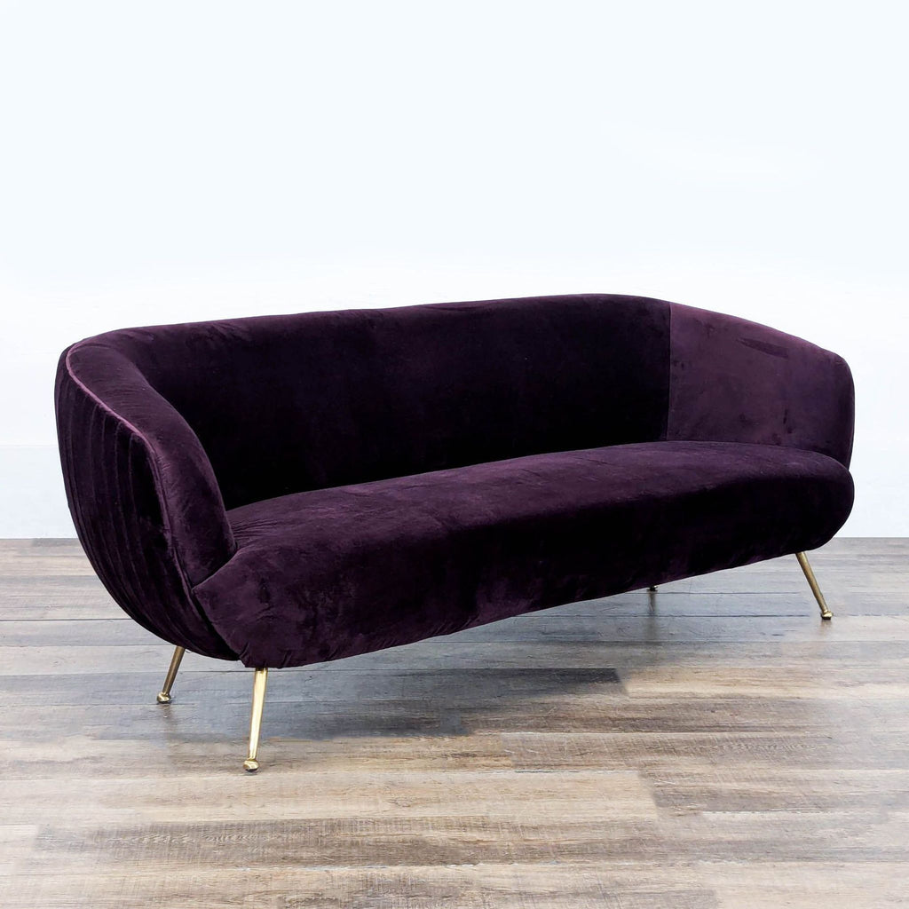 3. Angled view of Reperch 3-seat sofa featuring pleated velvet, curved silhouette, and stylish gold pin legs.