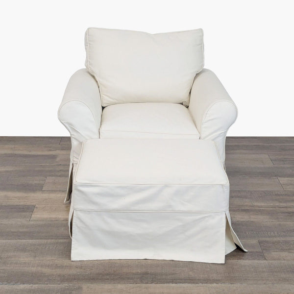 Front view of a Pottery Barn slipcovered lounge chair with deluxe down blend cream cushions and ottoman.  