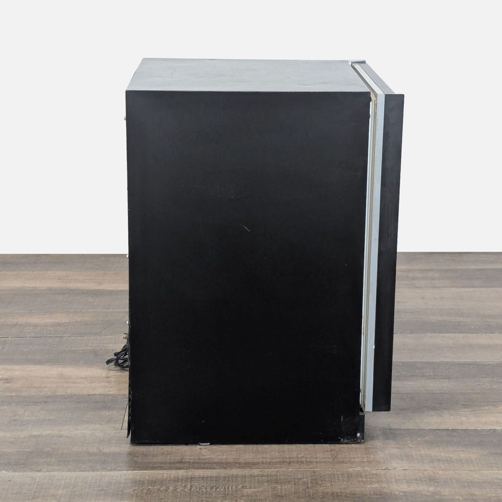 Side view of Marvel wine cooler with black finish and partially open glass door, highlighting sleek design.