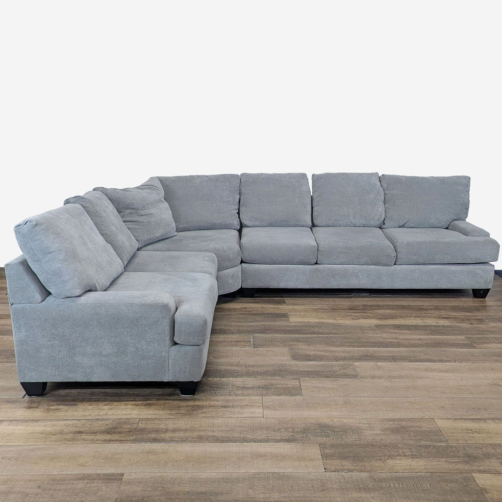 1. Modern light gray four-piece L-shaped sectional with left chaise, plush cushions, and soft chenille fabric by Living Spaces.  