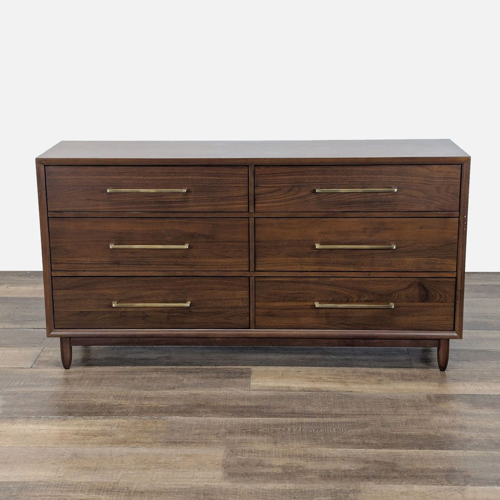 1. Northridge Home walnut dresser with six drawers, brass handles, and a mid-century modern design on wooden floor.