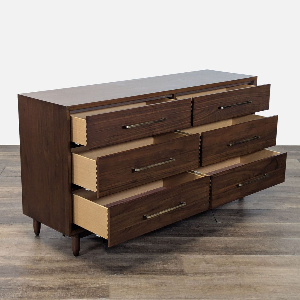 2. Angled view of a walnut Northridge Home dresser featuring six open drawers with dovetail construction.