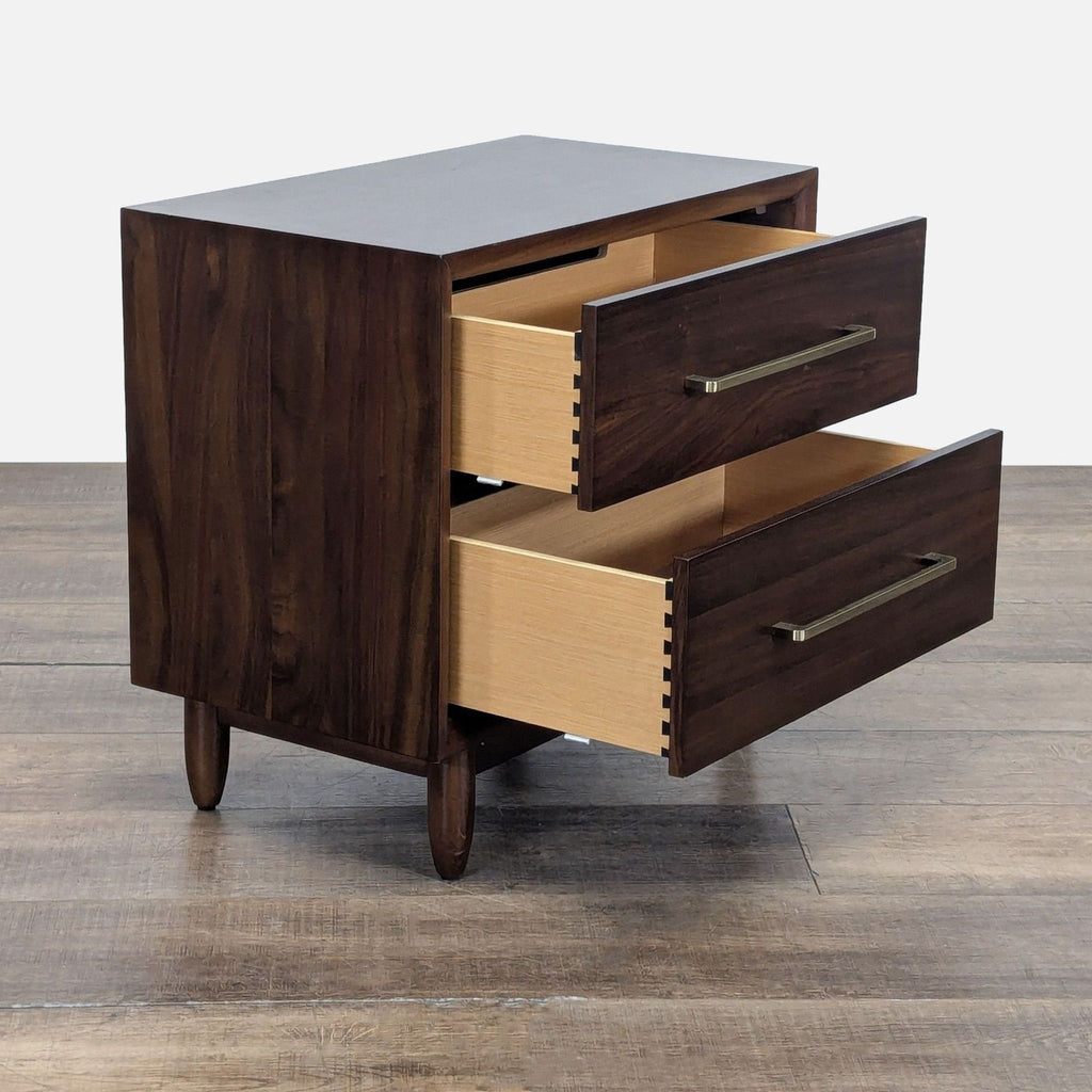 Side angle of a Northridge Home mid-century end table showing two open spacious drawers and tapered legs.  