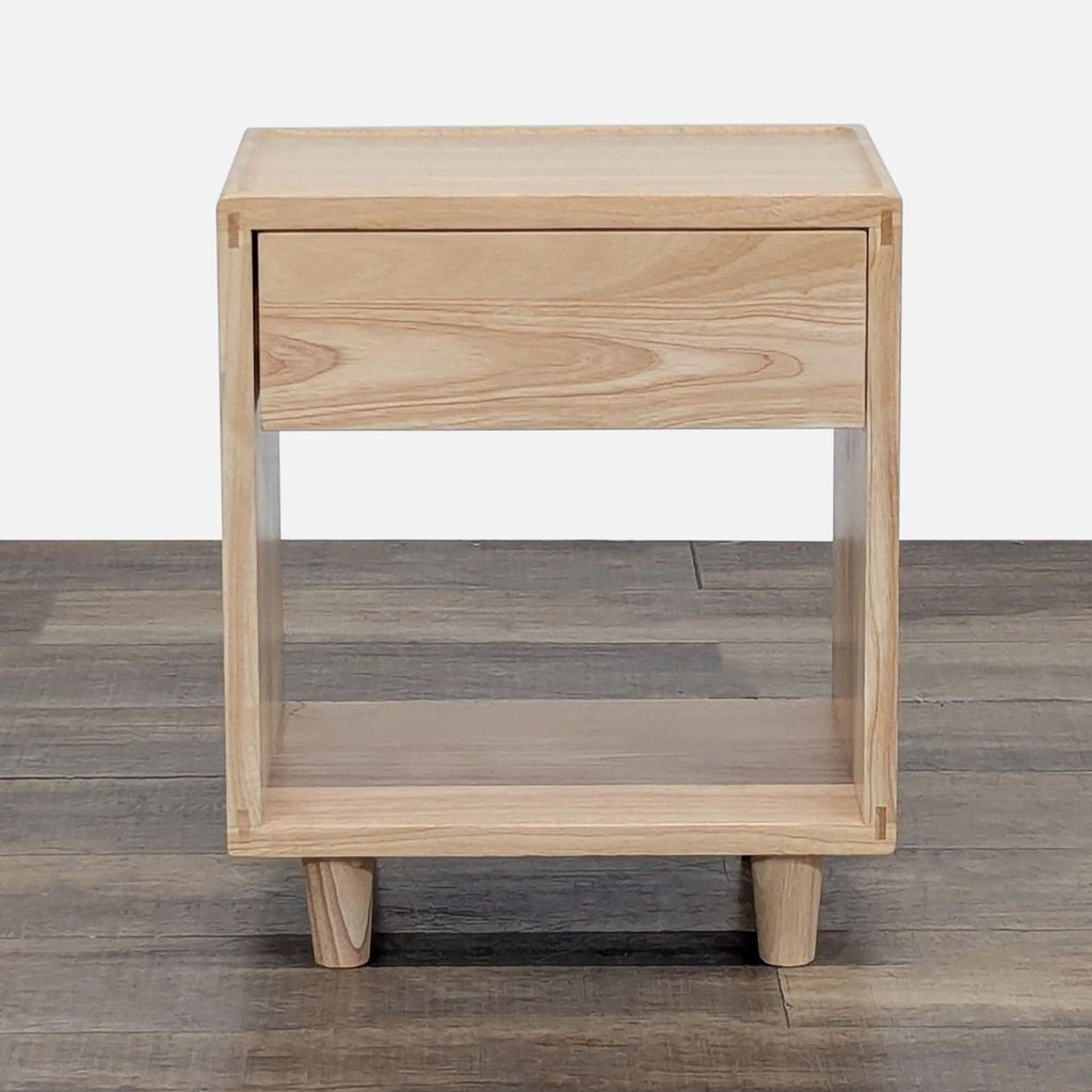 1. Thuma end table with natural wood finish, featuring one drawer and an open lower shelf, on wooden legs.  