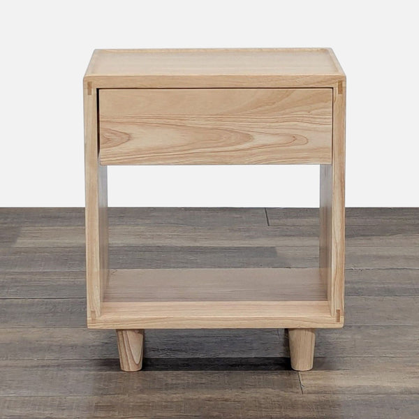 1. Thuma end table with natural wood finish, featuring one drawer and an open lower shelf, on wooden legs.  