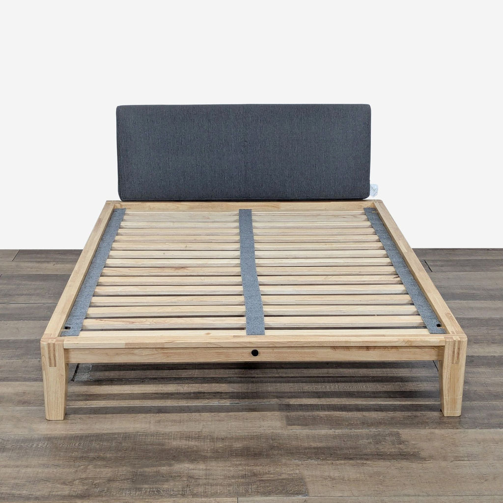 1. Reperch wood platform bed frame with slats, Japanese joinery, and upholstered Pillowboard, seen from front.