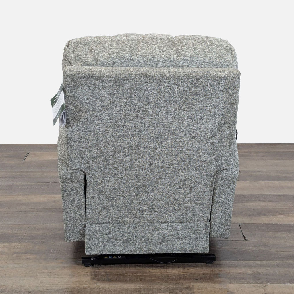 Rear view of the La-Z-Boy lounge chair highlighting its sturdy back, textured upholstery, and simple design.