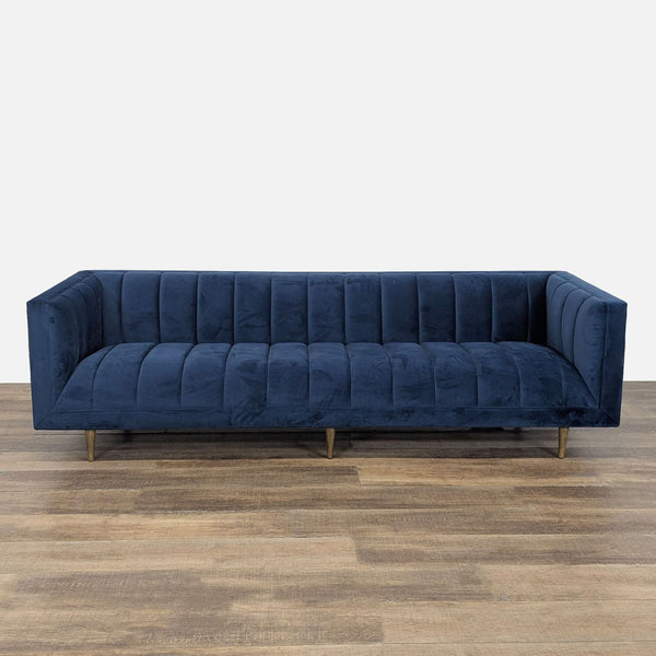 1. Four Hands 3-seat sofa in navy, featuring plush channel tufting, a tuxedo silhouette, and tapered wood legs.