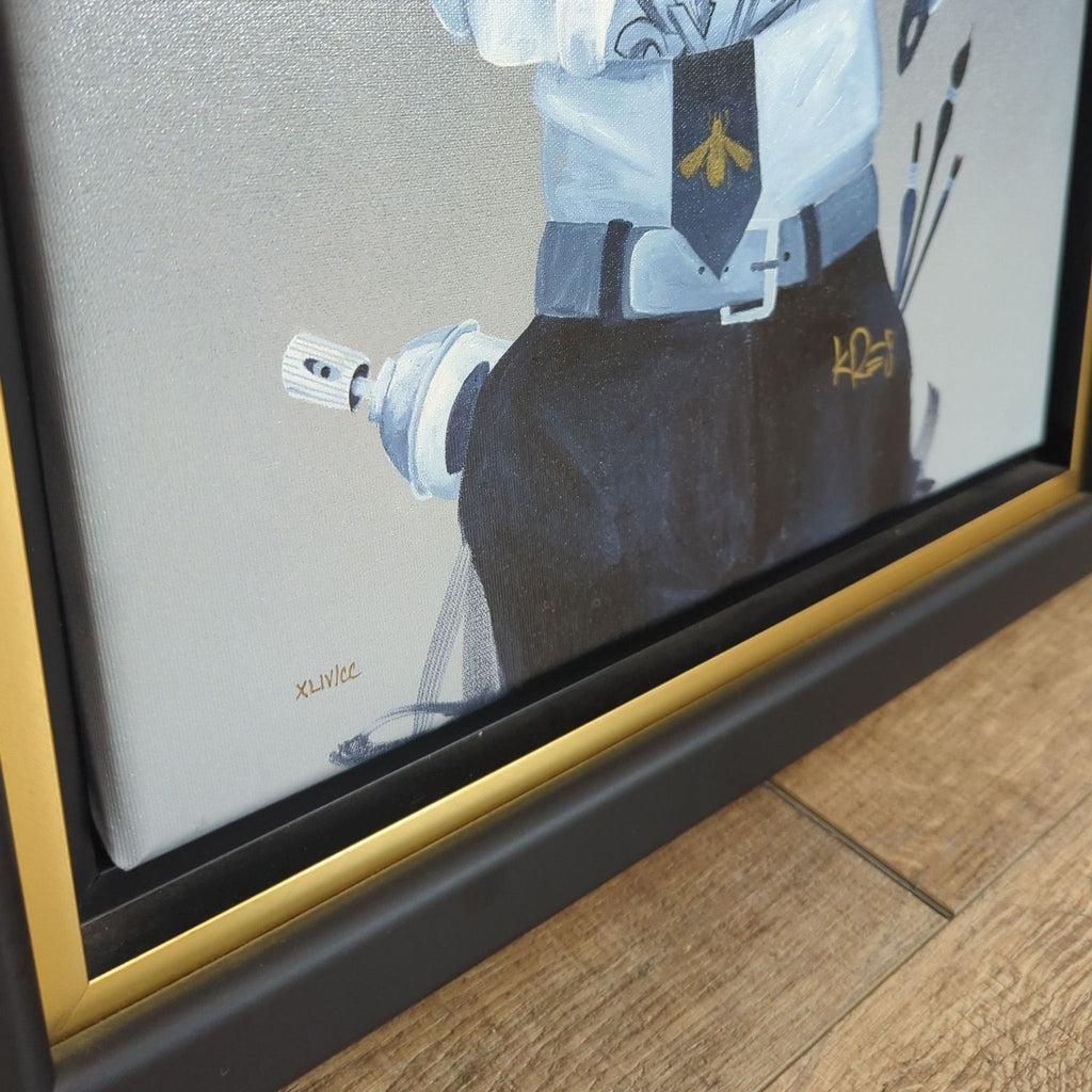 2. Close-up of the lower corner of a framed canvas giclee showing the artist's signature and fine painting details.