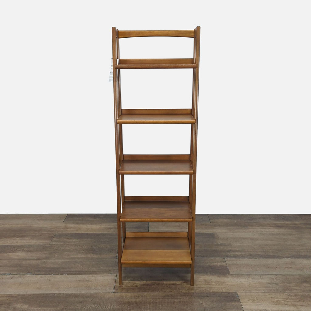 1. Front view of a West Elm bookshelf made from kiln-dried, sustainably sourced wood, showing five shelves.