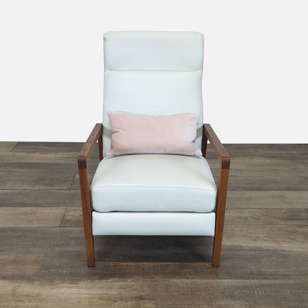 Front view of a Reperch Scandinavian-inspired lounge chair with white leather upholstery and wood arms.  