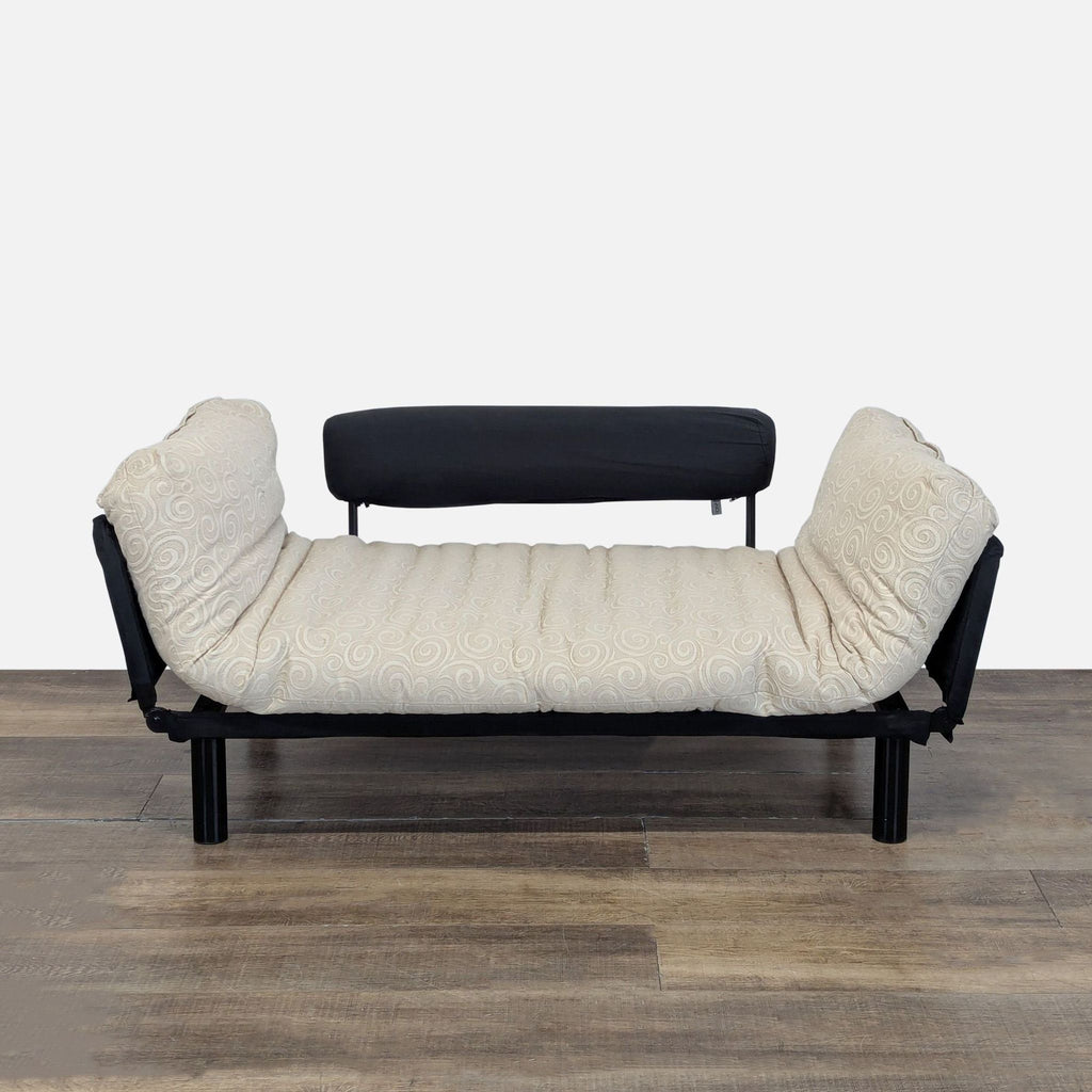 1. Innovation brand convertible sofa with sides folded down, showing a custom firm mattress in beige fabric.