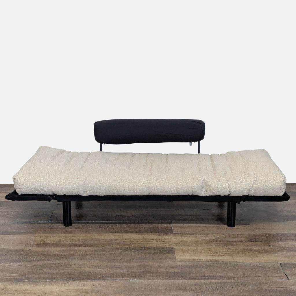 2. Beige Innovation sleeper sofa fully extended into a bed with a custom firm mattress and modern design.