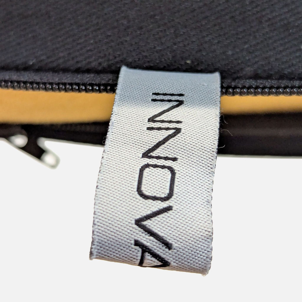 Innovation Convertible Sofa with Adjustable Armrests and Black Frame