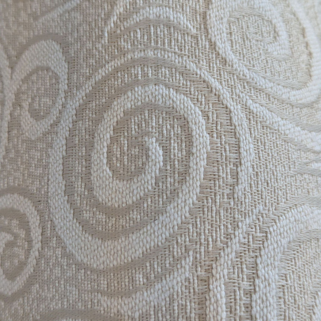 3. Closeup of the beige mattress fabric's swirled textured pattern on the Innovation sleeper sofa.