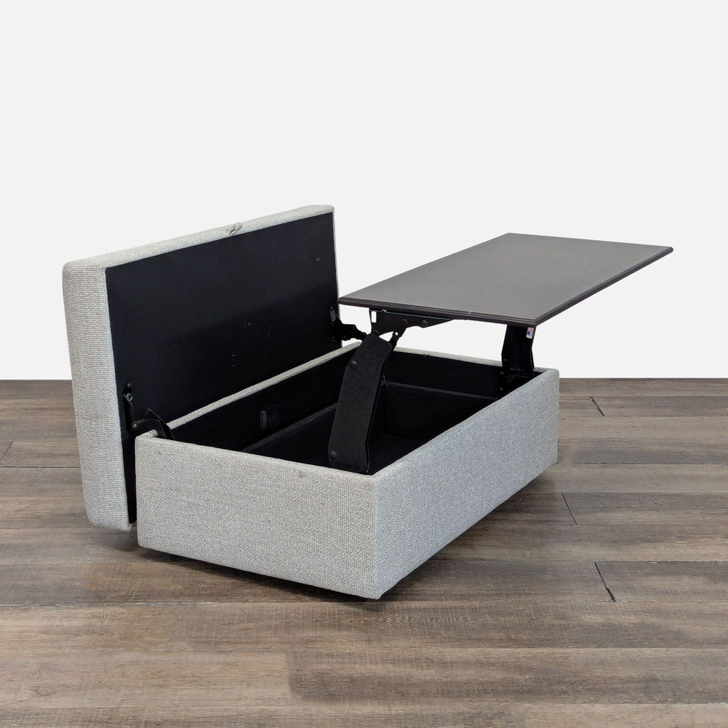 2. Pottery Barn ottoman open to reveal storage space and an elevated black lift-top tray.