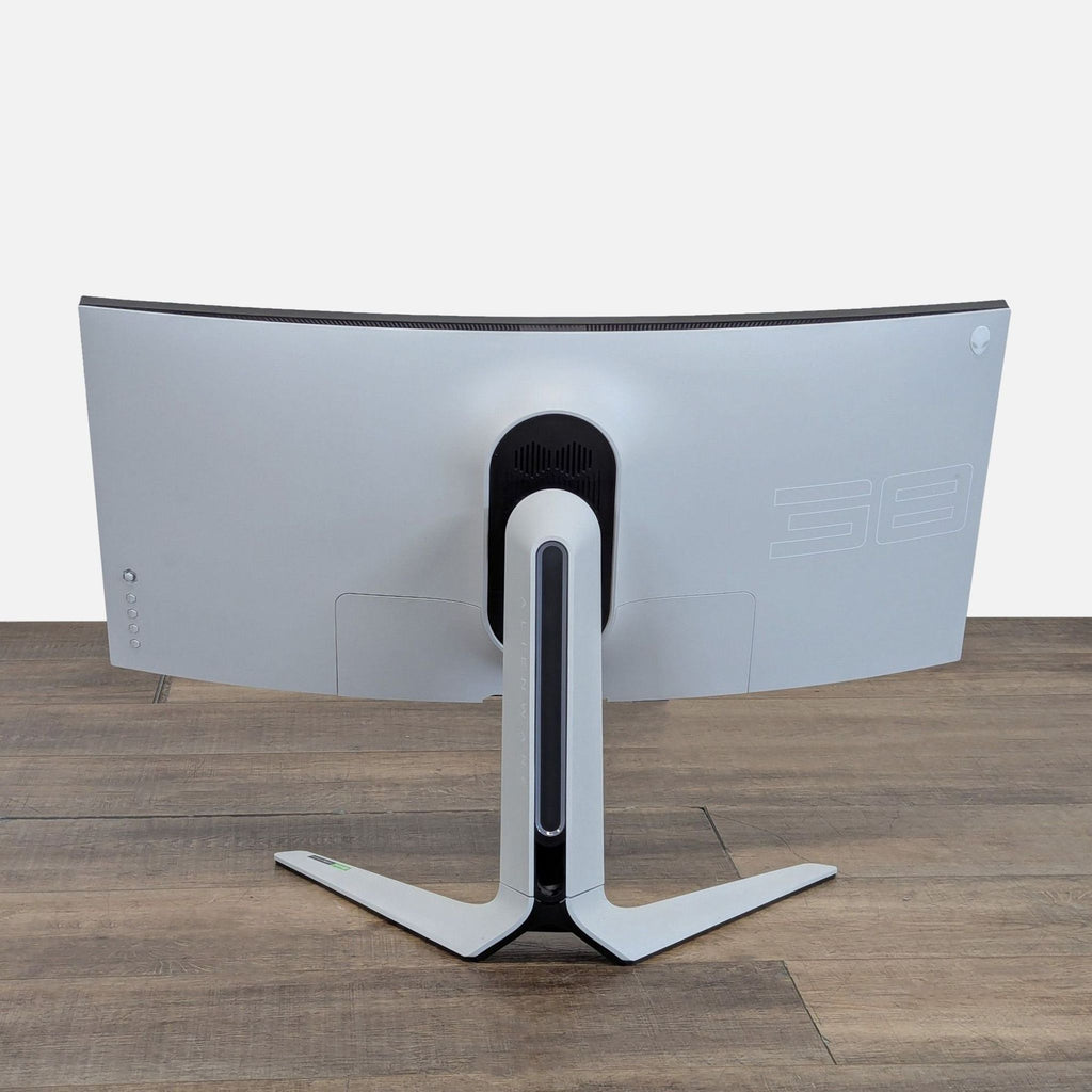 2. Rear view of Alienware curved monitor showing its modern white chassis, stand, and signature back panel design.