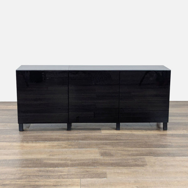 1. Black Ikea sideboard with sleek, glossy finish and three front-facing cabinet doors, shown on wooden floor.