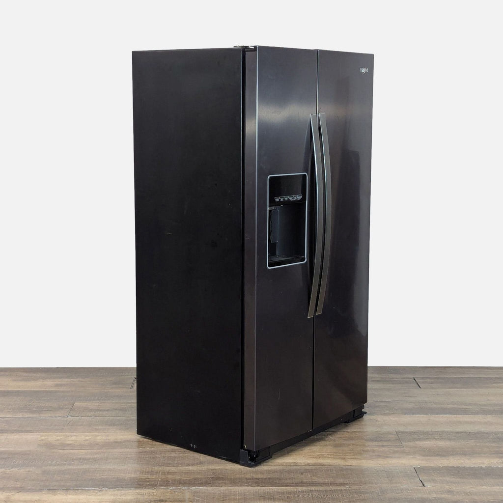 3. Angled view of Whirlpool refrigerator featuring sleek black stainless steel finish and modern integrated handles.