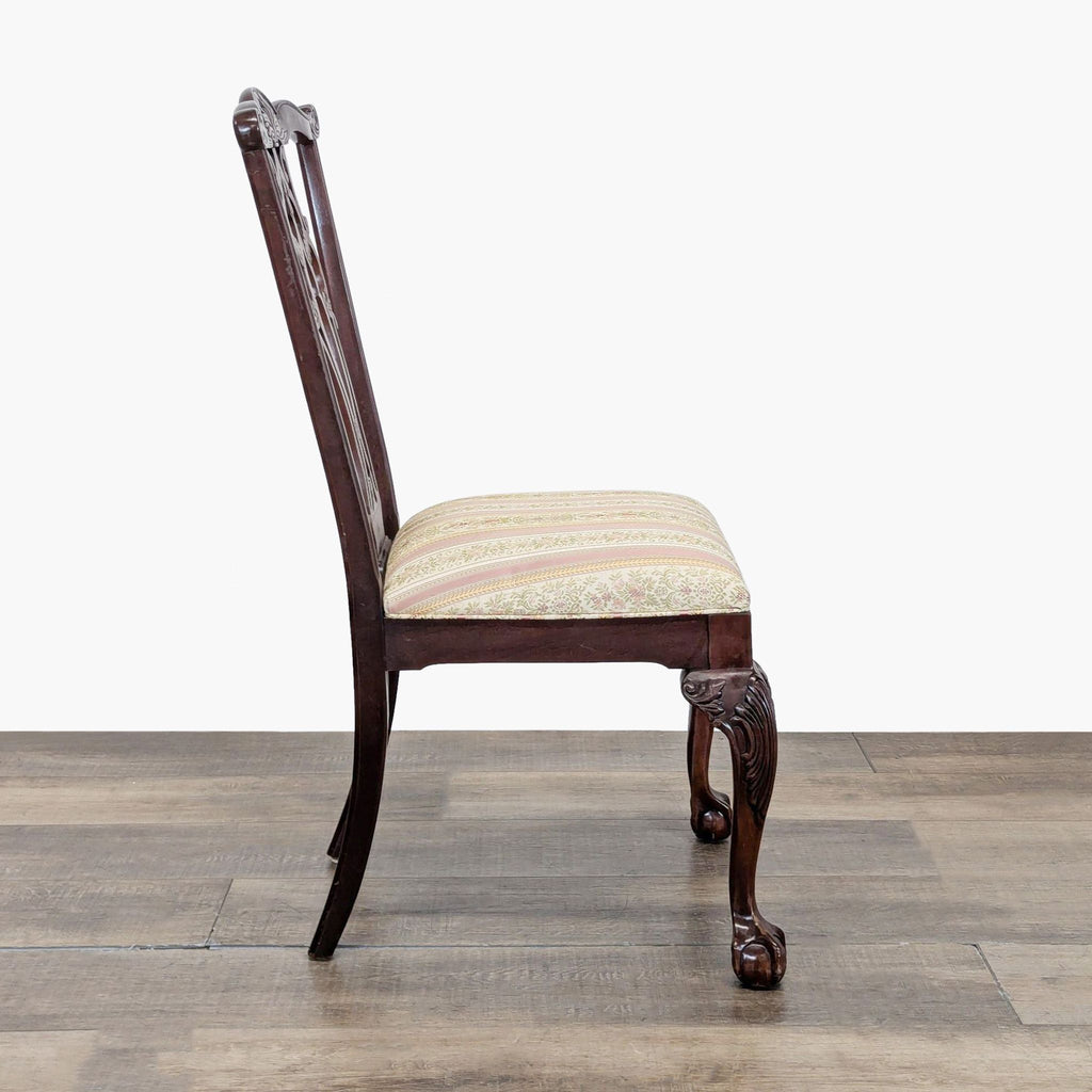 2. Side view of an Ethan Allen dining chair showcasing carved wood, upholstered seat, and ball and claw feet.