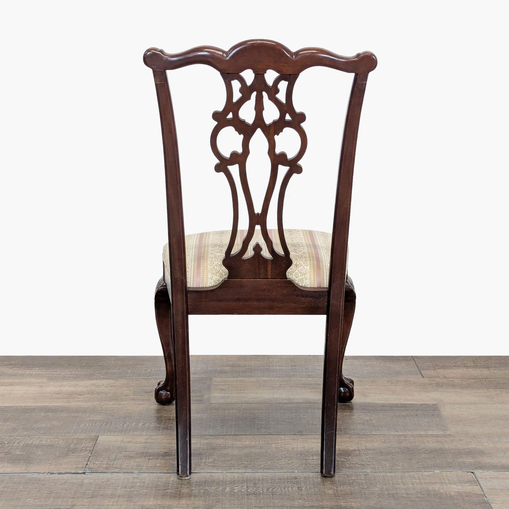 3. Rear view of an Ethan Allen dining chair with ornate carved backrest and classic wooden frame design.