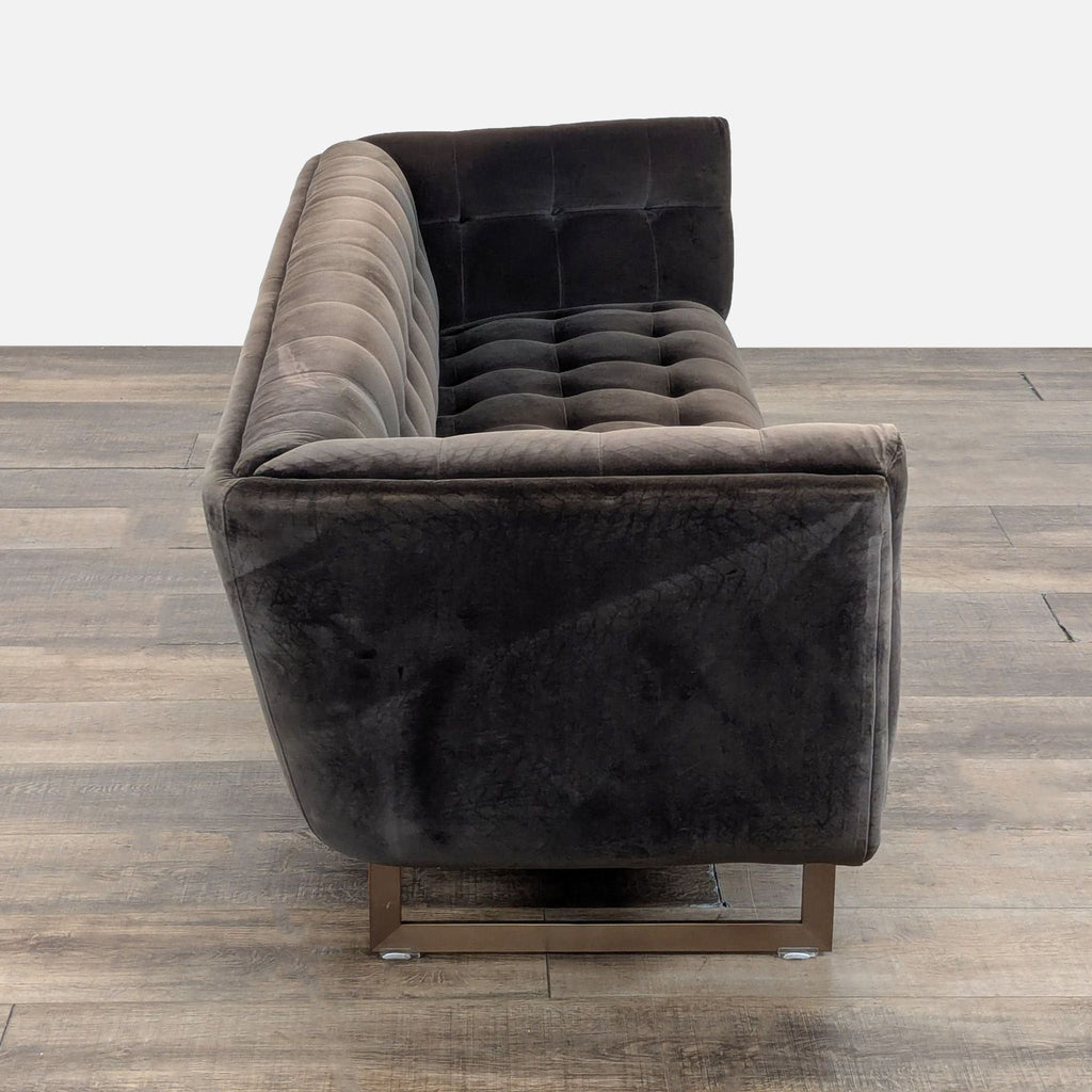 2. Side view of a Sunpan velvet 3-seat sofa, highlighting button tufting and metal base design details.