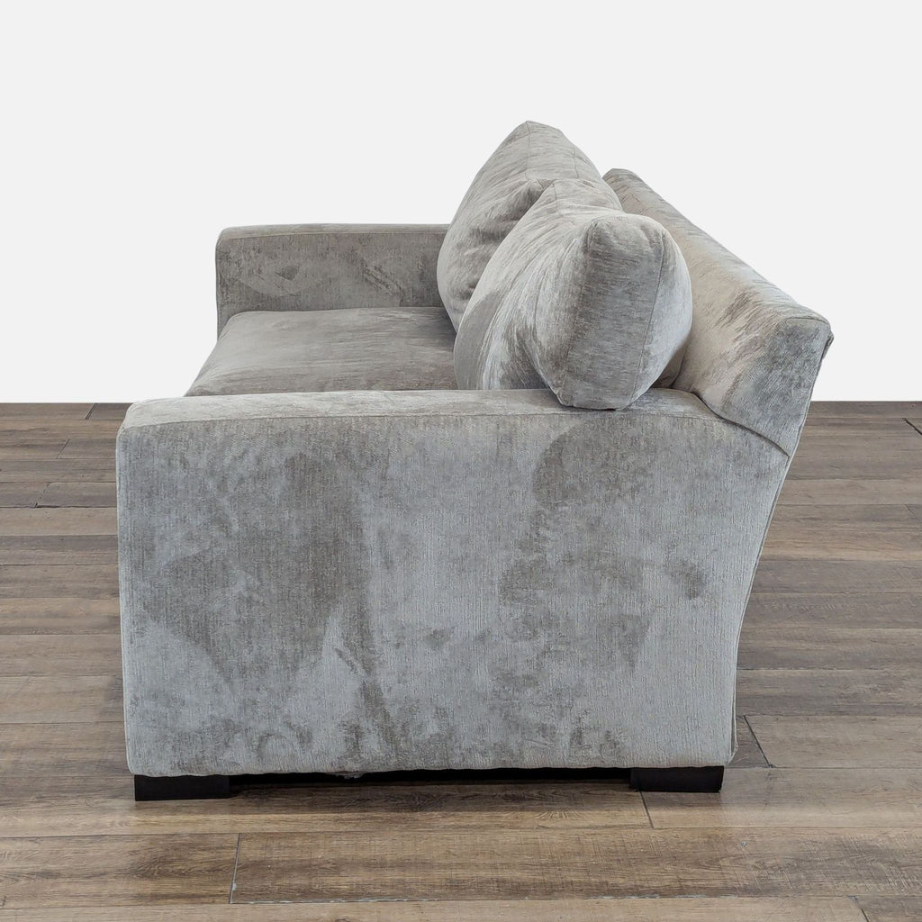 Angled side view of Reperch 3-seat sofa showing soft chenille upholstery and comfortable, deep seat cushions.