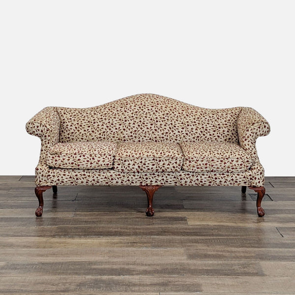Front view of a Reperch 3-seat sofa with floral upholstery and ball and claw wood feet.  