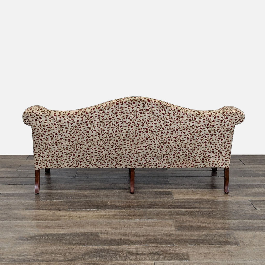 Rear view of the Reperch 3-seat sofa, showing the floral fabric and elegant curved backrest design.