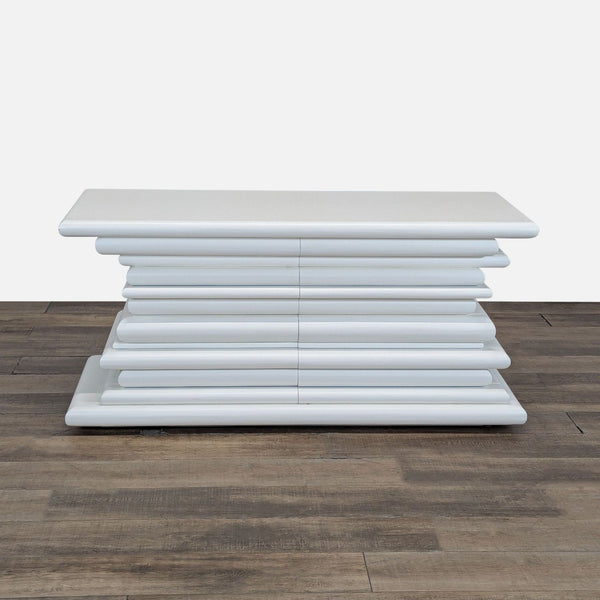 1. Reperch dresser with a white, stacked, rounded design featuring six horizontal drawers, front view.