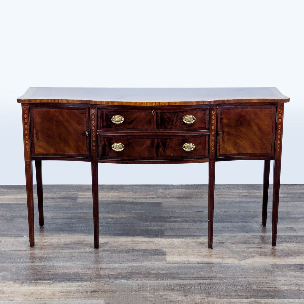 1. Ethan Allen mahogany serpentine sideboard with inlaid satinwood, two drawers, and brass hardware, closed view.  