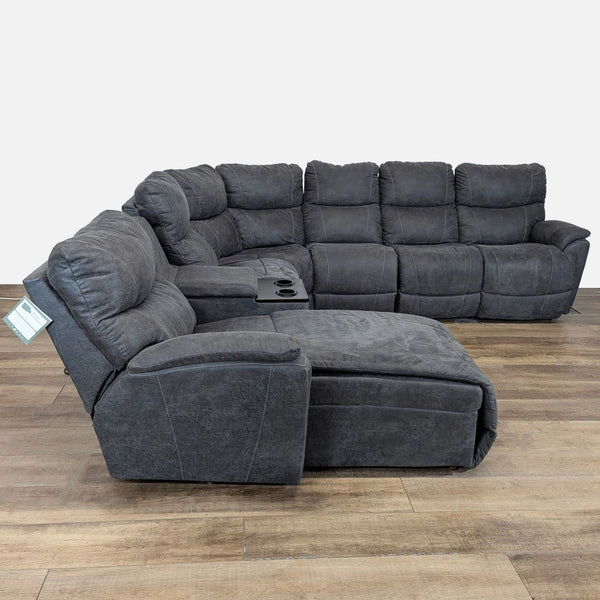 1. Large dark gray La-Z-Boy sectional with chaise, storage, cupholders, and power recline in a wood-accented room.