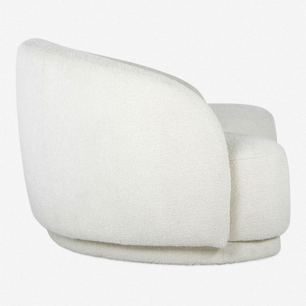 2. Angled back view of modern Lulu and Georgia 3-seat sofa showing curved design and soft fabric.