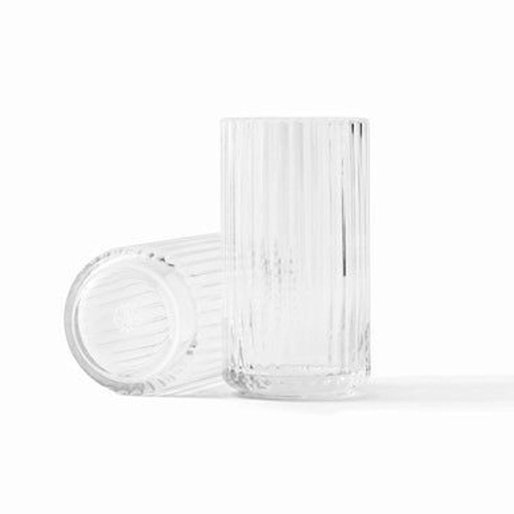 Two clear, cylindrical Lyngby Porcelain vases with vertical grooves, showcasing minimalist, functional 1930s design.