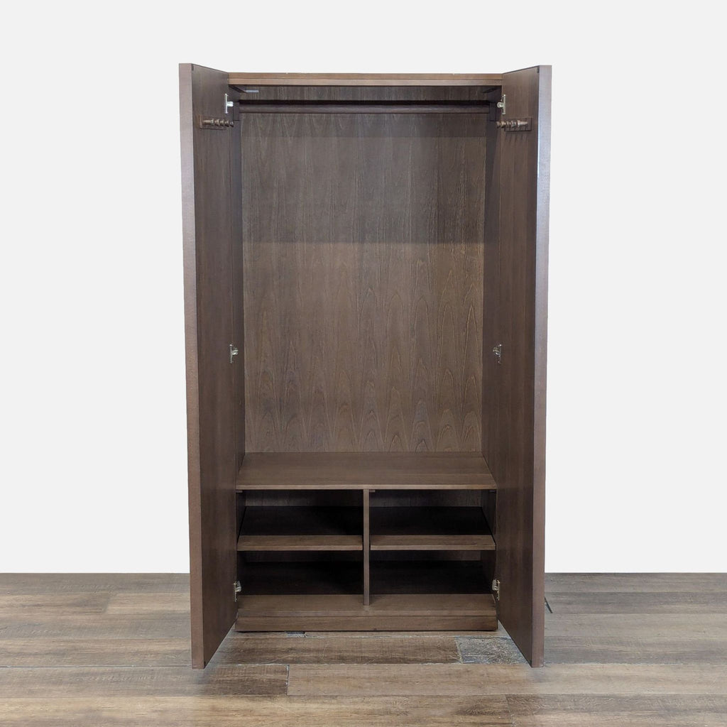 2. Interior of CB2 armoire showing hooks, hanging rod, one fixed shelf, and adjustable divided shelves.