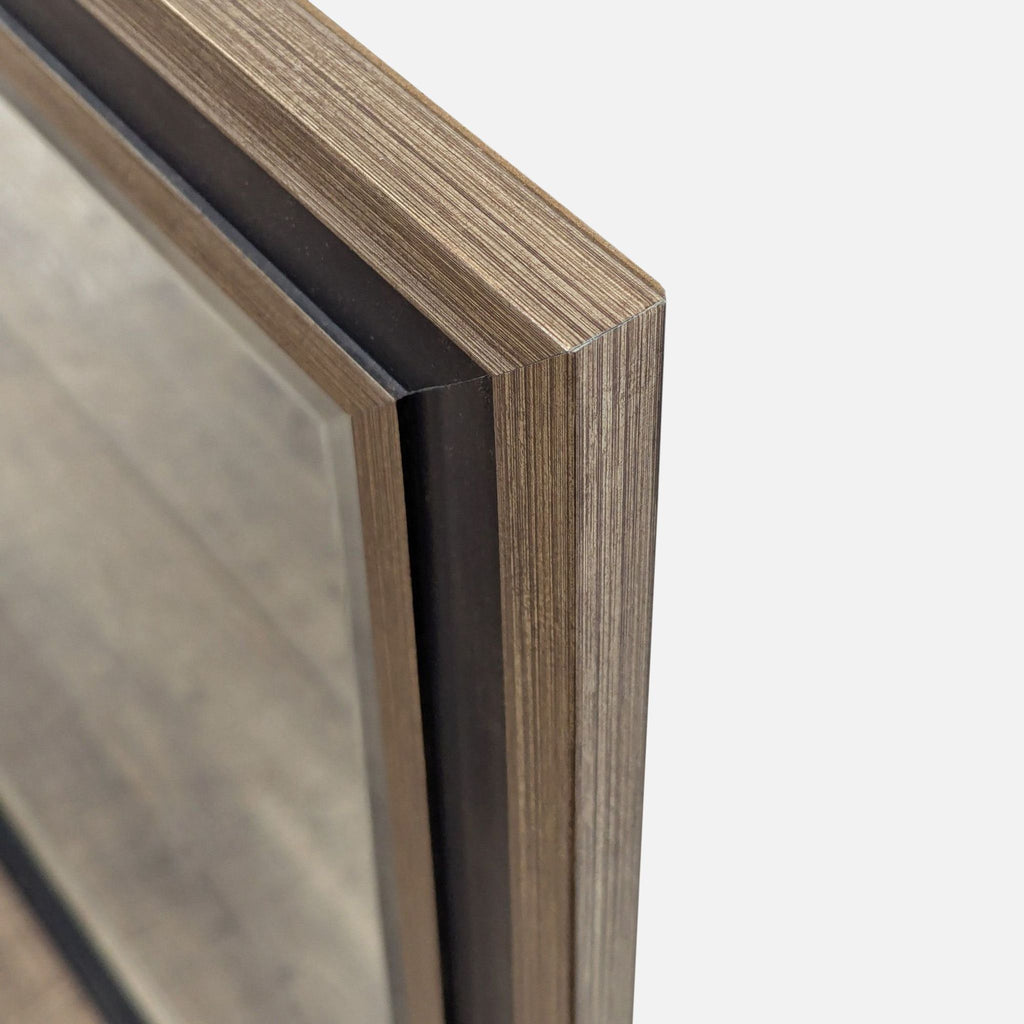 2. Close-up view of the Reperch mirror frame showing its textured wood finish and layered construction.