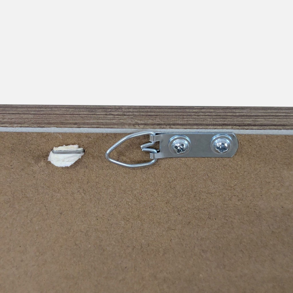 3. Rear view of the Reperch mirror displaying a metal hanging hardware and a wood back panel.