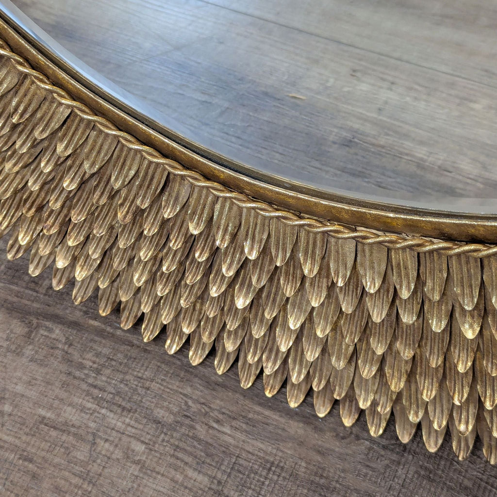 2. Close-up of the Reperch mirror shows a detailed, gold, feather-like patterned frame design.