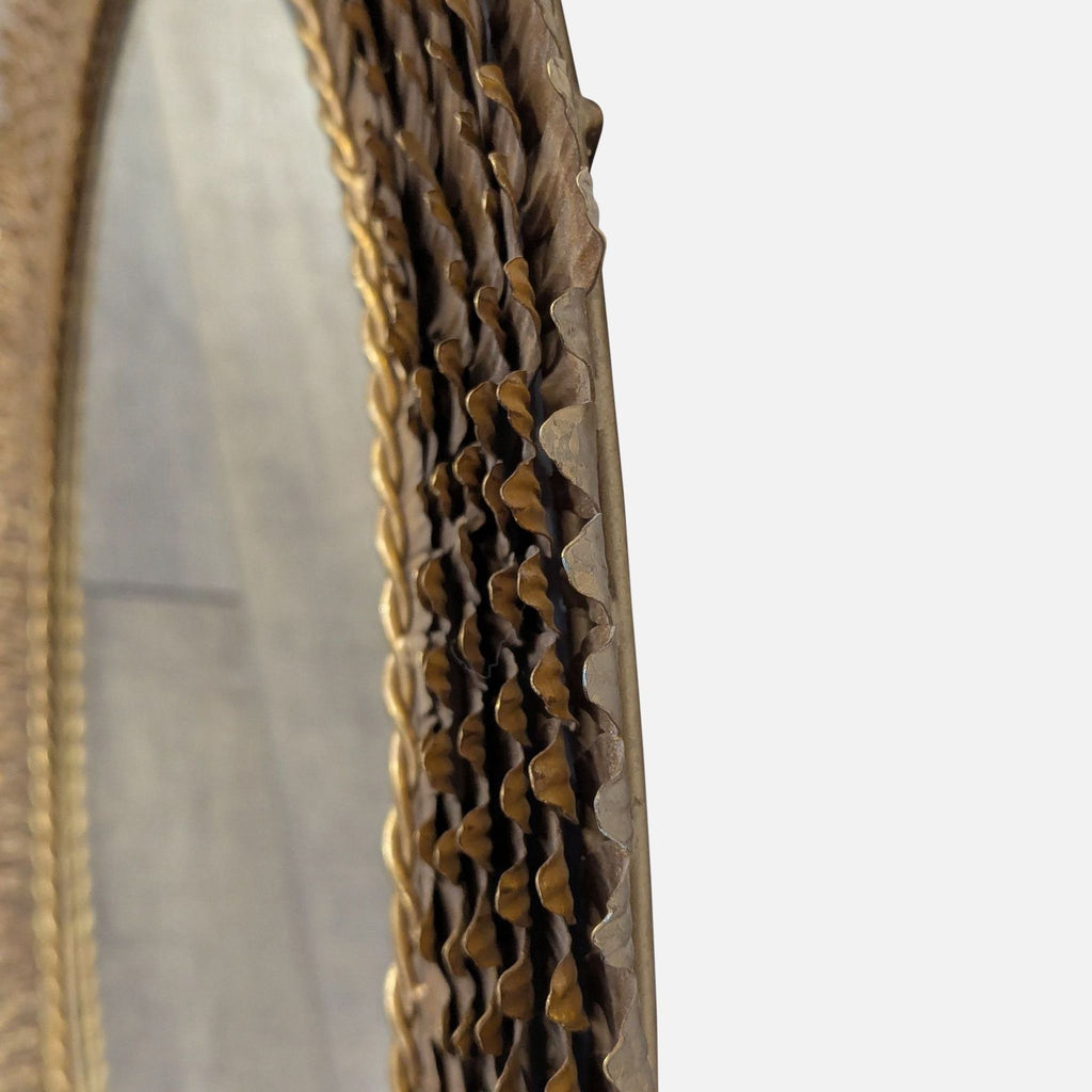3. Side view of the Reperch mirror highlights the three-dimensional, layered gold feather frame texture.