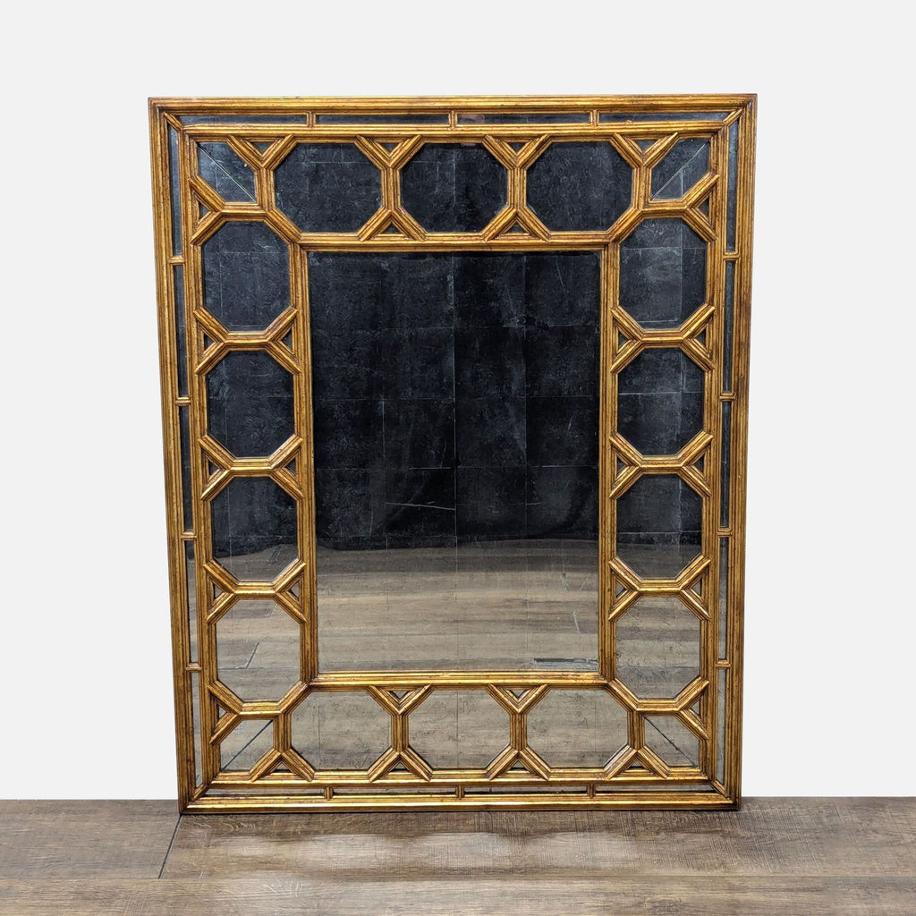 1. Rectangular antiqued mirror with beveled center, framed by octagonal coffered mirrored plates and gold-toned trim.