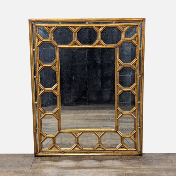 1. Rectangular antiqued mirror with beveled center, framed by octagonal coffered mirrored plates and gold-toned trim.