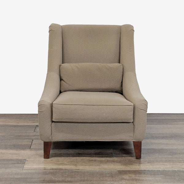 Front view of a taupe lounge chair upholstered in performance wool, by Mitchell Gold + Bob Williams.