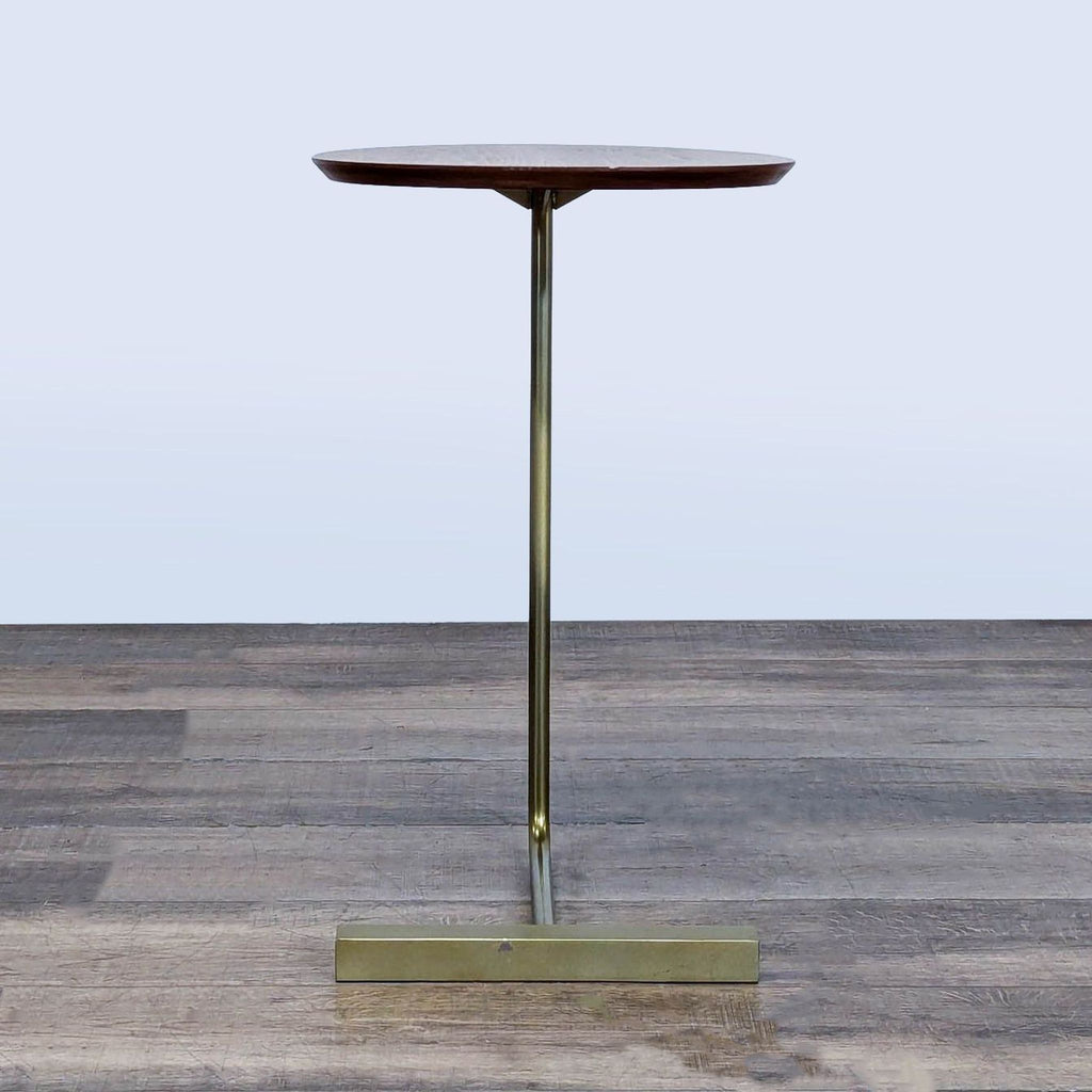 3. Slim West Elm side table with oval walnut wood top and minimalist brass metal base, side view.