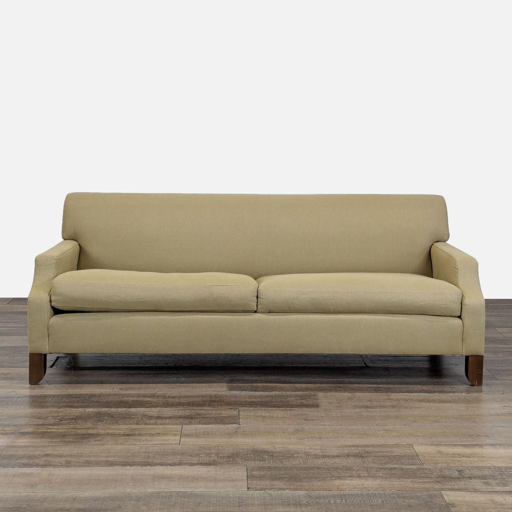 1. Front view of a Cisco Brothers modern 3-seat sofa with sloped arms and tapered wood legs on wood flooring.