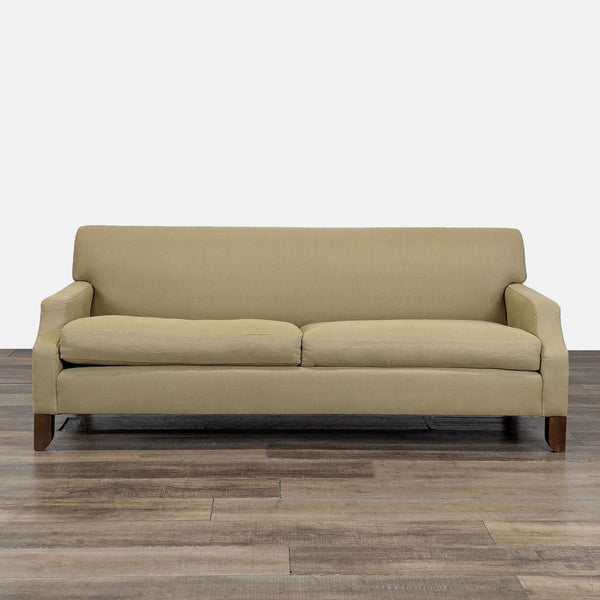 1. Front view of a Cisco Brothers modern 3-seat sofa with sloped arms and tapered wood legs on wood flooring.