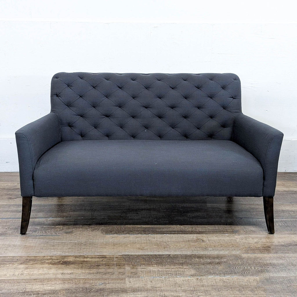 1. Jason Furniture loveseat with tufted back, dark fabric upholstery, and wooden legs, shown from the front.