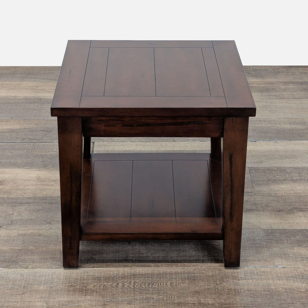 3. Overhead angle of a World Market end table, highlighting its smooth top and functional lower shelf.