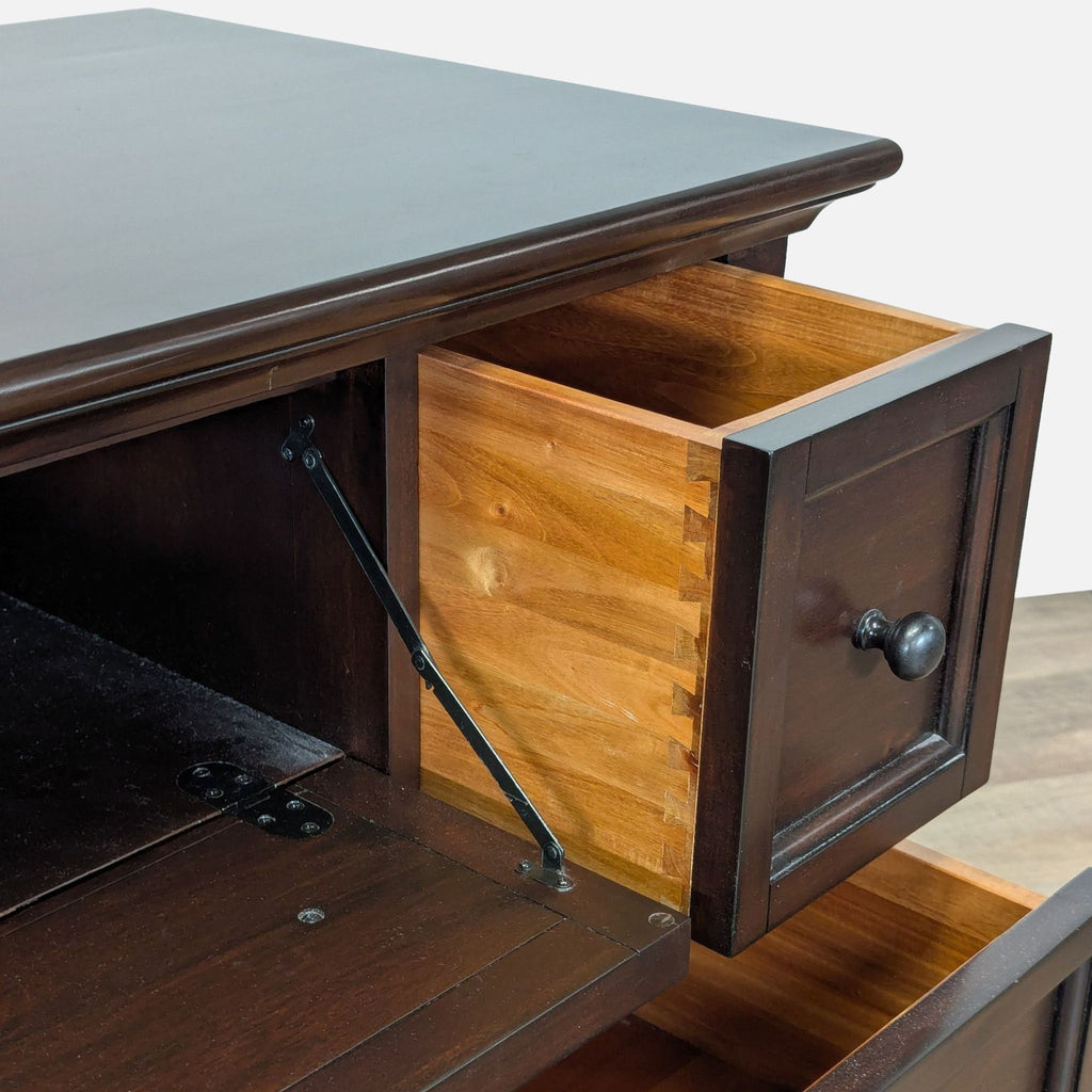3. Closeup of Pottery Barn dresser showing dovetail joints on an open drawer and dark wood finish.
