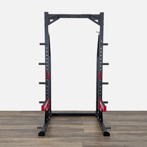 Front view of a Titanium Strength adjustable power rack squat stand with pull-up bar, J-hooks, and spotter arms.
