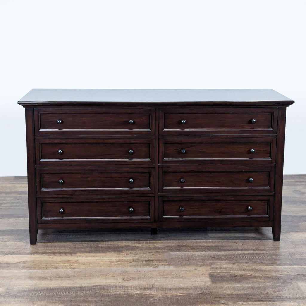 1. Pottery Barn dresser with dark wood finish and 8 recessed panel drawers, shown on wooden flooring.